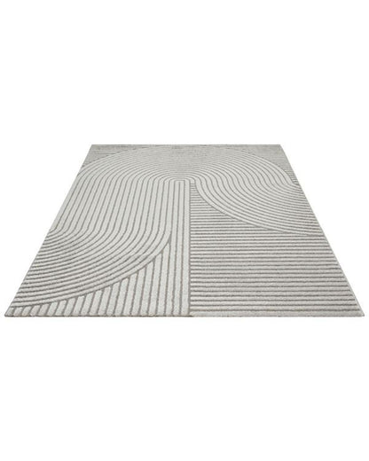 Vue verticale montrant la répétition élégante des motifs en arc du tapis ELIO 51, idéal pour agrandir visuellement l'espace.