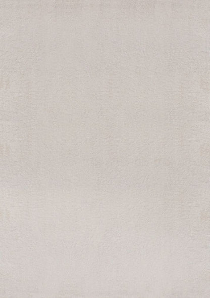 Tapis rectangulaire LOFT beige présenté sur fond blanc uni, montrant la couleur blanc cassé pure et la texture dense à poils hauts.