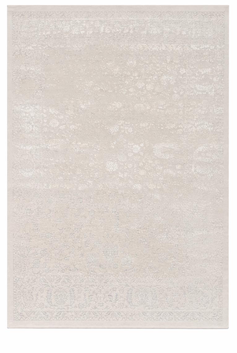 Vue d'ensemble du tapis CREATION vintage crème, motifs persans détaillés avec relief 3D sculpté sur fond blanc épuré.