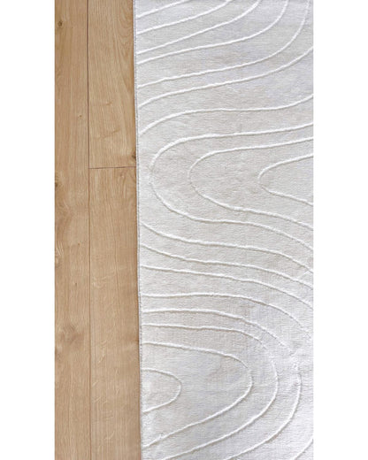 Zoom sur les finitions soignées et les motifs géométriques du tapis STILO 01.